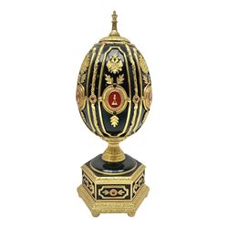 Franklin Mint House of Faberge; The Imperial Jeweled Egg Chess set, the egg opening to reveal a chess board, with a draw to the hexagonal base holding the miniature chess pieces, H23cm 