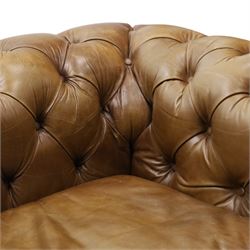 Timothy Oulton for HALO - Three seater brown leather chesterfield sofa, with button back and arms, with two loose cushions, raised on a dark stained supports terminating in castors 