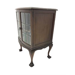 Mid to late 20th century mahogany bow front cabinet, the moulded top over two glazed doors with bevelled glass, moulded and foliage carved apron, acanthus decorated cabriole supports with ball and claw feet