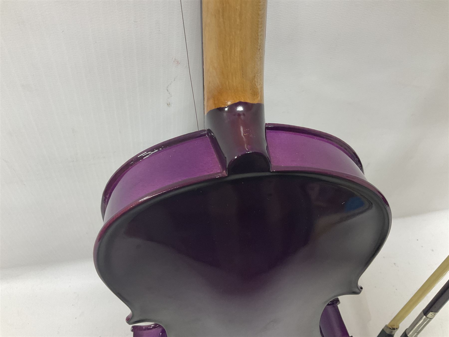 Intermusic 3/4 violin with a violet coloured solid wood body, ebonised fingerboard and fittings, bow and hard case, length 54cm
