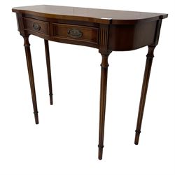 Regency design mahogany serpentine console table, fitted with single drawer disguised as two with cockbeaded facia, raised on fluted tapering supports