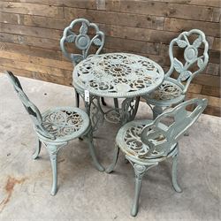Victorian design cast alloy circular garden table and four cast iron chairs, green painted