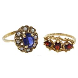 Gold three stone garnet ring and  a gold pearl and blue paste stone set cluster ring, both 9ct 