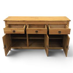 Contemporary oak sideboard, with rectangular top above three drawers and three cupboard doors, blackened metal handles, raised on stile supports