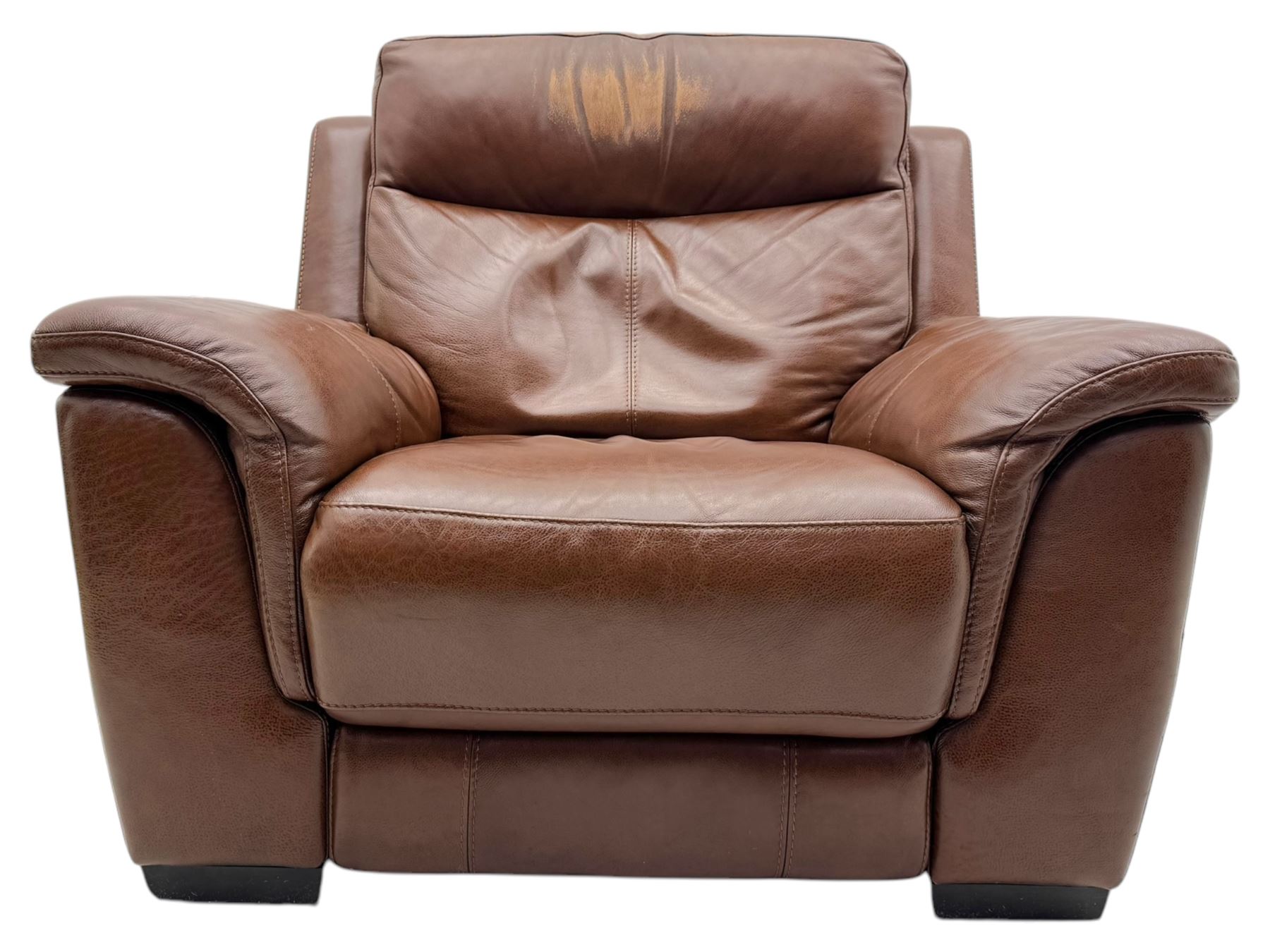 DFS - 'Liaison' reclining armchair upholstered in brown leather, upholstered in tan leather with stitched panel backrest and generously cushioned seat and arms, operated by wired remote, raised on block feet