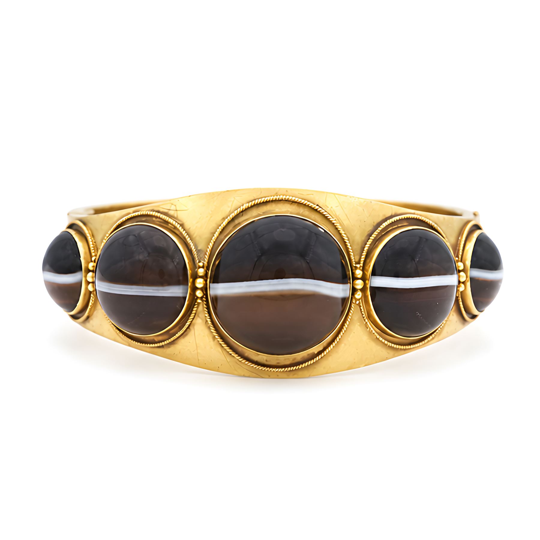 Victorian gold banded agate hinged bangle, set with five graduating cabochon cut agates, surrounded by wirework and bead decoration