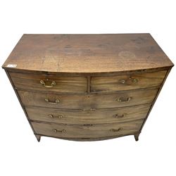 Early 19th century mahogany bow-front chest, fitted with two short over three long cock-beaded drawers, on splayed feet