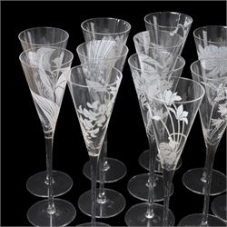 Twelve Crystal champagne glasses Les Fleurs, issued by the Franklin Mint in collaboration with Perrier Jouet, each glass is etched with a different flower, all boxed 