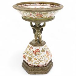 Wong Lee comport, with polychromatic enamel floral decoration, the stem formed as kneeling...
