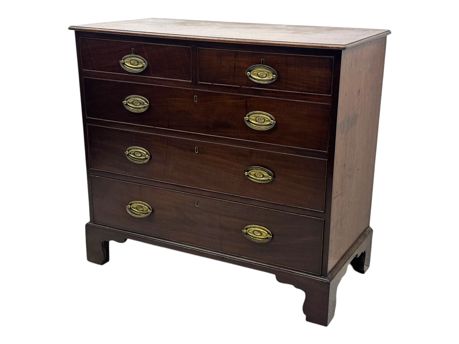 George III mahogany chest, rectangular top with moulded edge over two short and three long graduated cockbeaded drawers, each fitted with brass oval handles, on bracket feet