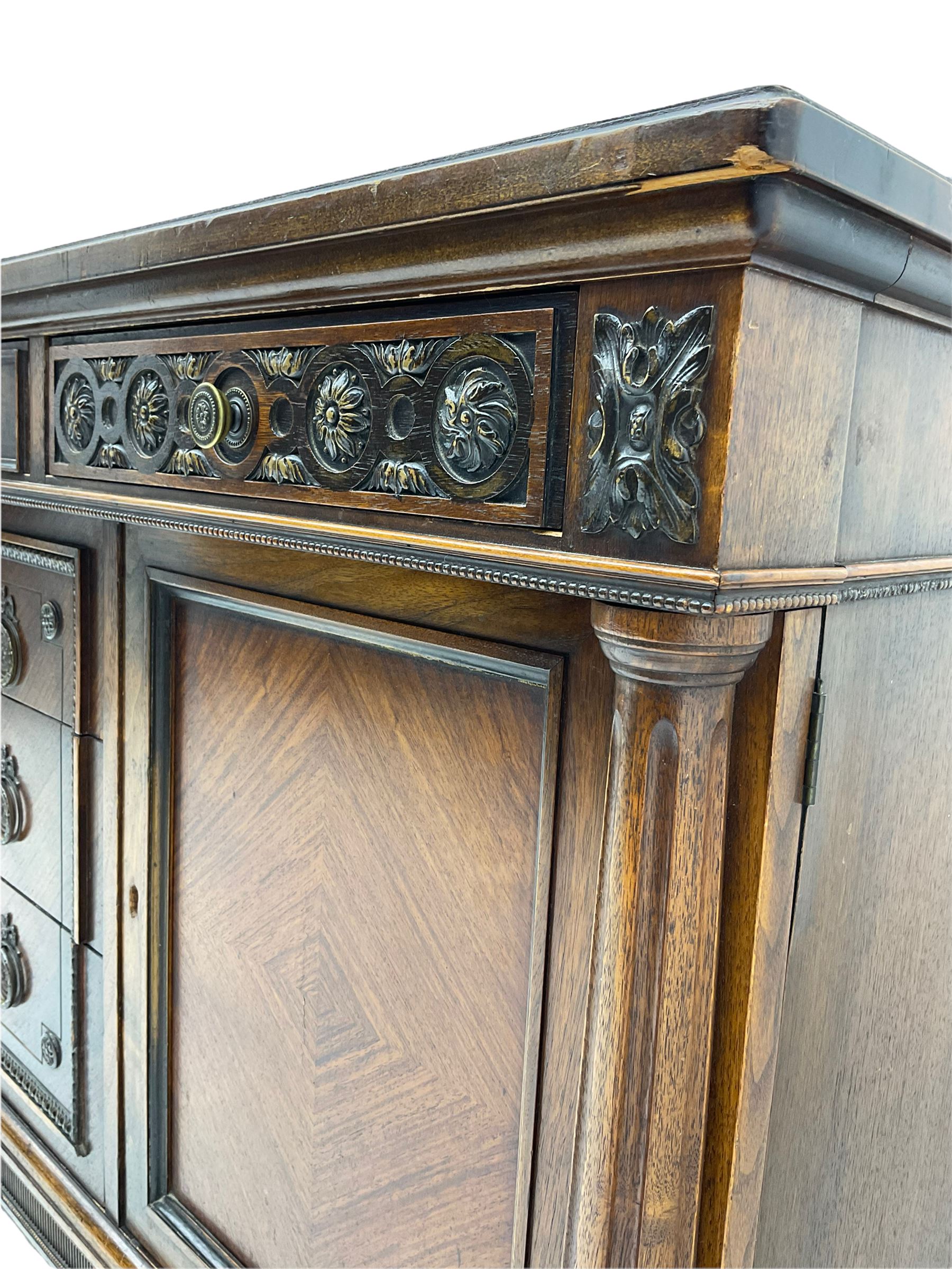 Early 20th century French walnut sideboard, fitted with six drawers and two cupboards