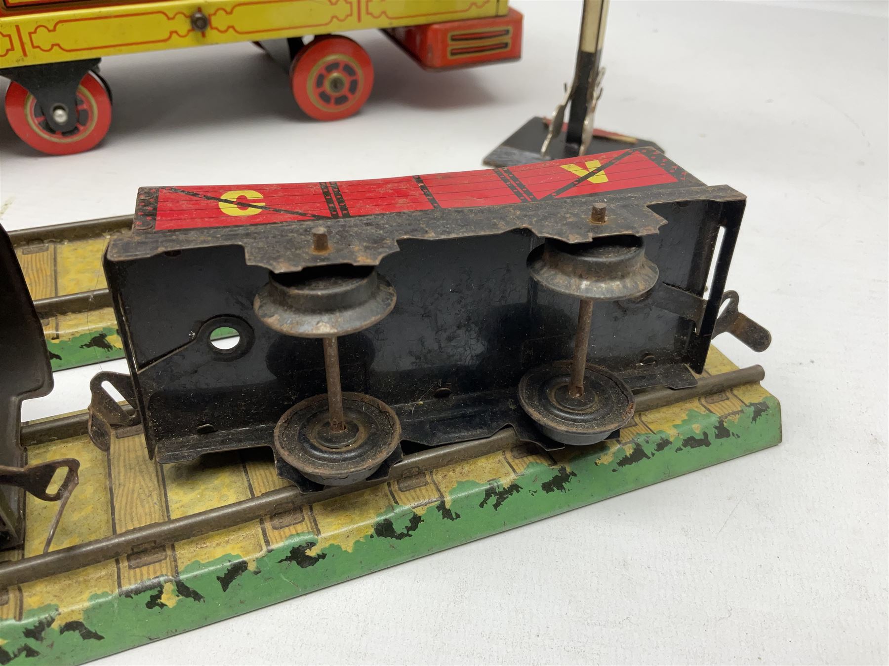 Chad Valley '0' gauge - clockwork tin-plate train set comprising LMS 0-4-0 tender locomotive No.3402 with two open wagons, loop of track and wooden signal; unboxed; and Japanese battery operated tin-plate Broadway Trolley bus No.10430