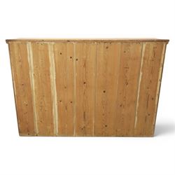 Victorian waxed pine low cupboard, fitted with two panelled doors and panelled sides, two interior shelves