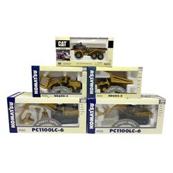 Four Joal Komatsu 1:50 scale die-cast models comprising WA600-3 Log Loader, HD605-5 Dump Truck and two PC1100LC-6 Material Handler, together with a CAT Articulate Truck, all boxed (5)