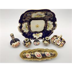 18th century and later porcelain comprising a pair of miniature Derby twin-handled vases, H8cm, similar style porcelain basket, probably Derby, oval pen tray on four paw feet, two 19th century vases and a 19th century square dessert serving plate painted with exotic birds within white reserves (7)