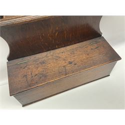 George III oak spoon rack and candle box, the shaped back with scroll crest, and two six aperture spoon racks, above a candle box enclosed by a sloped hinged lid, H54.5cm, W38cm, D13cm