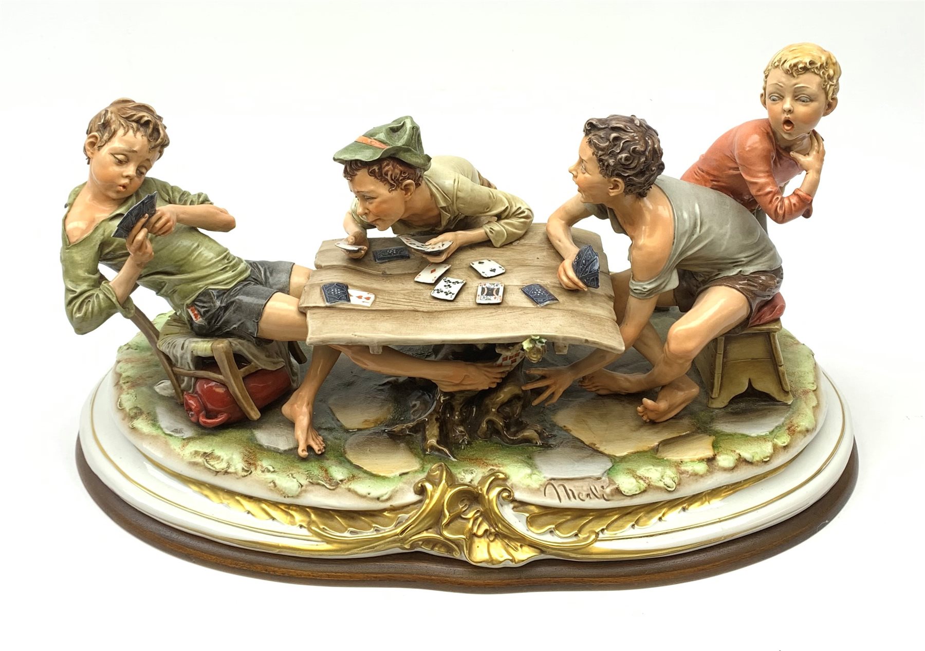 Large Capodimonte figure group 'The Card Cheat', modelled as four card