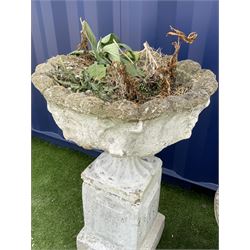 Composite stone scalloped urn on tall square plinth (H85cm), composite stone low planter with scrolled decoration (H45cm), large planter decorated with masks and foliage swags (H51cm) - THIS LOT IS TO BE COLLECTED BY APPOINTMENT FROM DUGGLEBY STORAGE, GREAT HILL, EASTFIELD, SCARBOROUGH, YO11 3TX