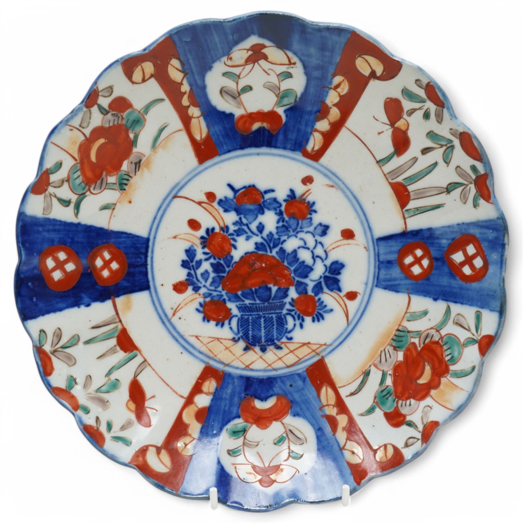 Japanese Imari charger decorated with panels of birds and flowers in orange, blue and red etc D37cm and two smaller Imari plates D21cm (3) 