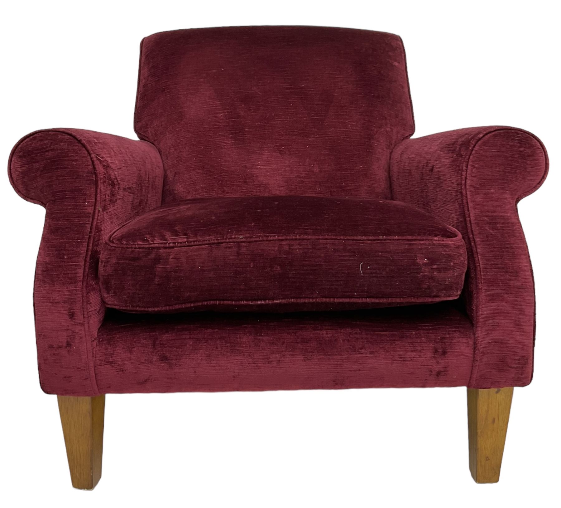 Duresta - traditional shape armchair upholstered in burgundy red velvet, on square tapering front supports (W88cm, H85cm, D103cm); together with a matching rectangular footstool with hinged seat, on turned feet with brass castors (73cm x 54cm, H38cm)