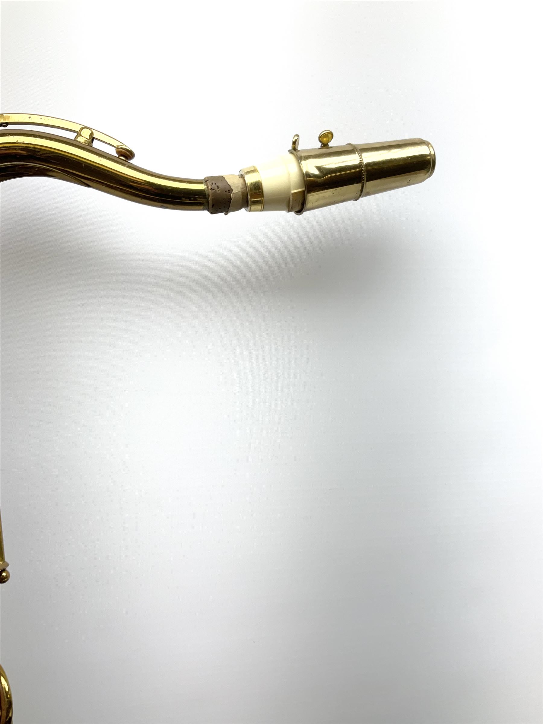Brass tenor saxophone by Adolphe SAX, 84 Rue Myrha, Paris,  No.938 serial number 12097, H75cm excluding crook; in hard carrying case bearing plaque for Henri Selmer