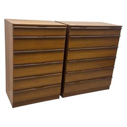 Avalon - two mid-20th century teak chests, with rectangular top above six graduated drawers, each fitted with recessed sculted pulls, raised on a flush plinth base.

(W 82cm D 55cm H 97cm)
(W 82cm D 55cm H 97cm)
