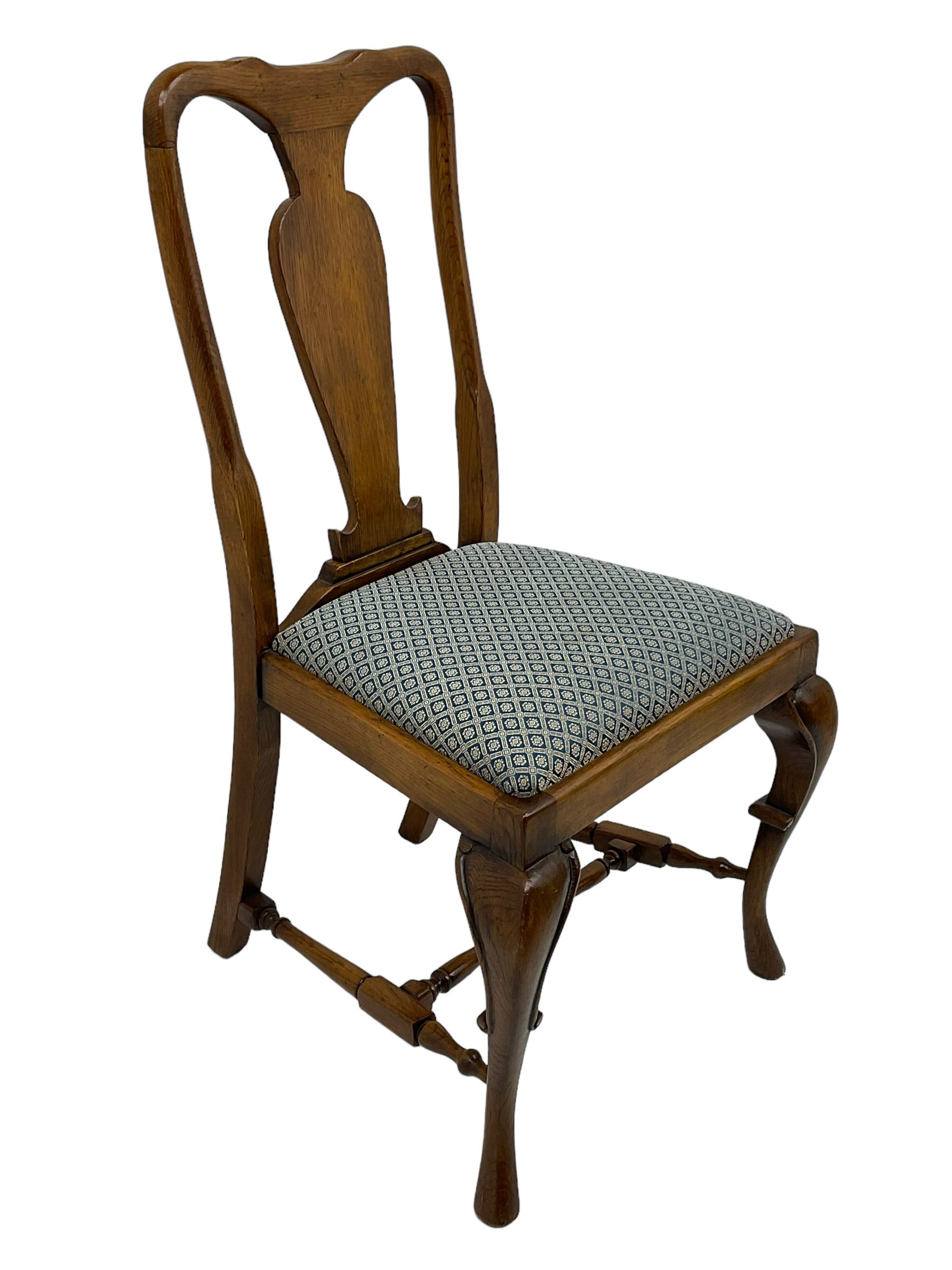 Late 20th century oak dining table, rectangular top with two draw leaf extensions, on turned supports united by moulded hayrake stretchers (180cm - 278cm x 90cm, H76cm); set of eight (6+2) oak dining chairs, shaped cresting rail over shaped splat back, upholster drop-in seat, on cabriole supports united by turned H-shaped stretchers 