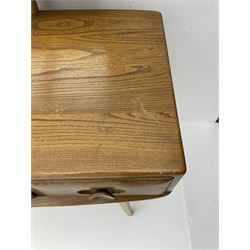 Ercol dressing table with raised back mirror, fitted with one long and two short drawers, raised on tapering supports 