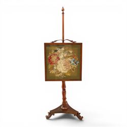 Two Victorian fire screens, comprising mahogany pole screen with glazed floral woolwork panel on turned support and triform base (H 142cm, W 48cm); and a larger carved walnut tapestry fire screen, glazed panel depicting a domestic interior scene, scroll carved cresting, barley twist uprights and turned stretcher base (H 75cm, W 49cm)