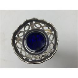 20th century silver specimen vase, of pierced trumpet form with flared rim, filled base, and blue glass liner, hallmarked Birmingham 