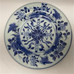Japanese Meiji period Arita blue and white plate, of circular form, painted with riverside landscape and bird upon flowering branch, with character mark beneath, D24.5cm, together with two 18th century Chinese blue and white plates, each painted with floral design, each approximately D22.5cm