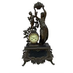 Vincenti and Cie - late 19th century figural clock garniture, cast figures in patinated bronze on a rectangular rococo plinth with splayed feet, drum cased Parisian 8-day twin train movement with an enamel dial, Arabic numerals and minute markers, striking the hours and half hours on a bell. With matching candelabra.  Garni H 70cm.  
