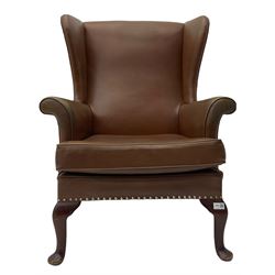 Parker Knoll - mid-20th century wing back armchair, upholstered in Rexine type cover