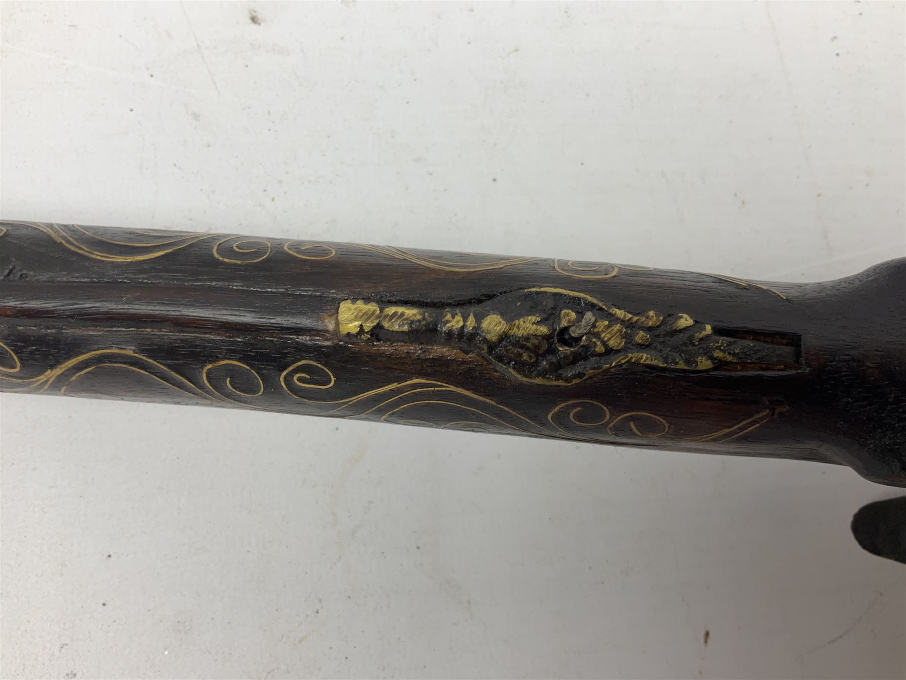 Reproduction flintlock pistol, the full walnut stock with brass filigree inlay and mounts and skull crusher butt L46cm; no visible proof marks FIREARMS CERTIFICATE REQUIRED OR RFD