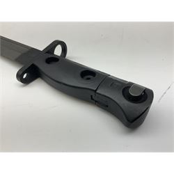 British Army L1A3 SLR Self Loading Rifle bayonet, with 20.5cm Bowie type fullered blade, hooked pommel with working push release button, grip secured by two deeply recessed rivets and marked L1A3 9600257 D71; in matching black scabbard L32.5cm overall