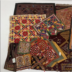 Two Indian Rajasthan tent hangings, worked in coloured threads with suspending fabric panels, large Indian throw worked in cross stitch with Camels and geometric pattern, similar style bags and panels etc