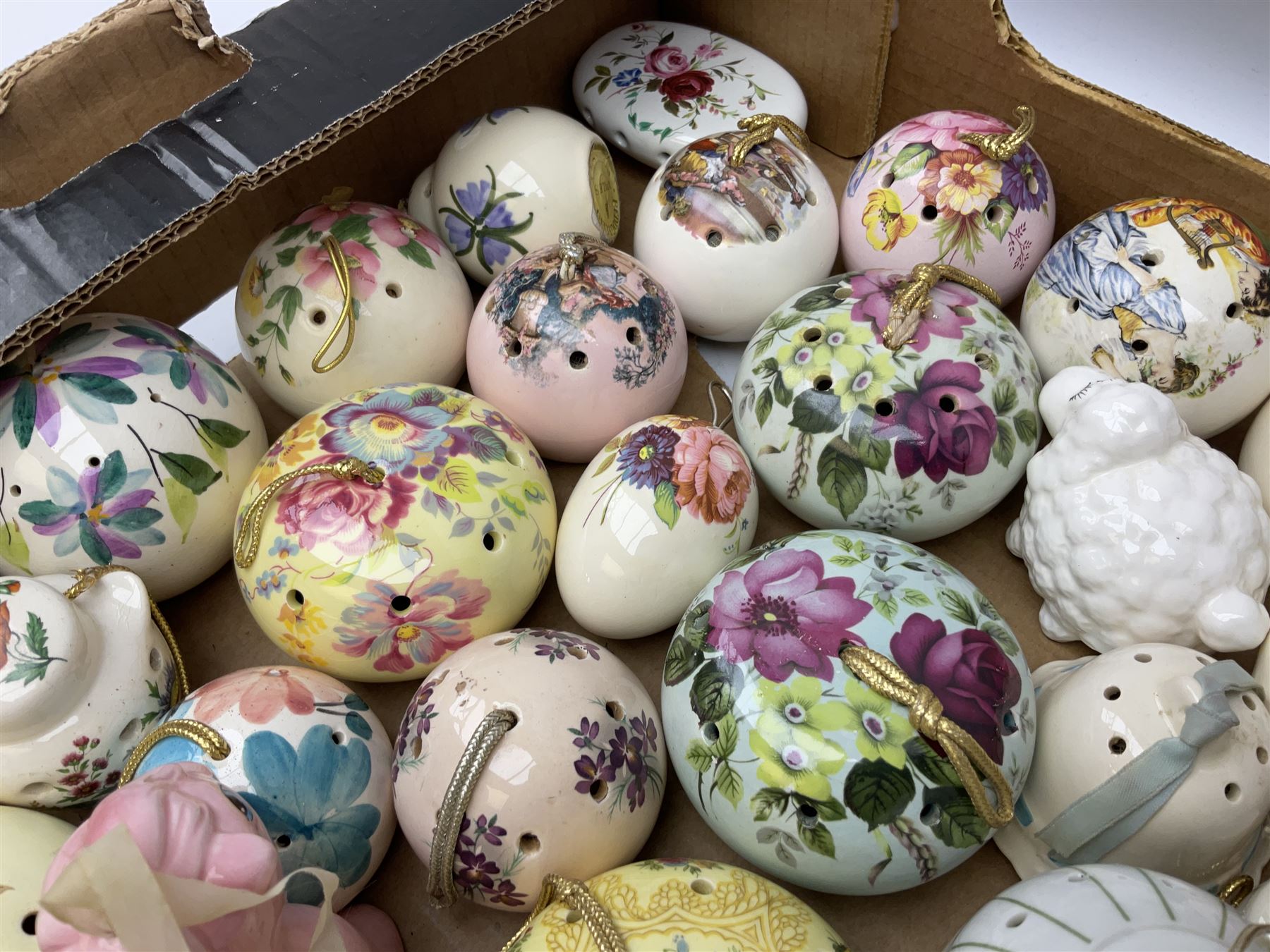 Large collection of ceramic pomanders, to include examples modelled as animals, floral examples etc