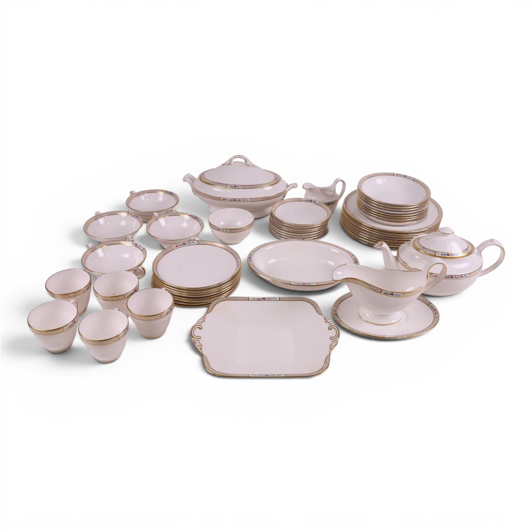 Spode Golden Trellis tea and dinner service for eight, including teapot, milk jug, open sucrier, teacups and saucers, dinner plates, soup bowls, side plates etc 