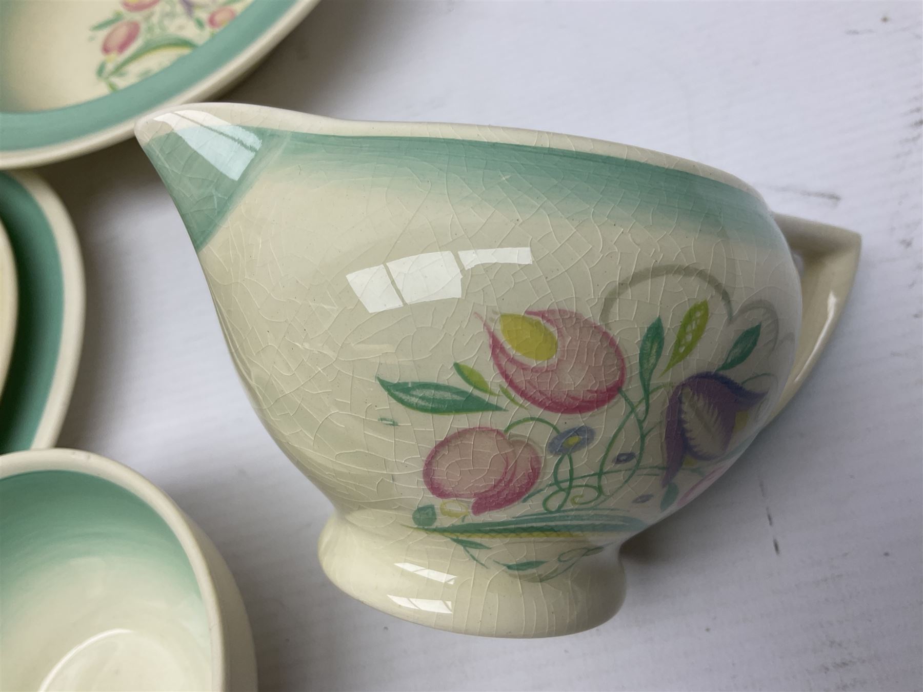 Susie Cooper Dresden Sprays pattern breakfast set, including coffee pot, sugar bowl, milk jug, egg cup, teacup trio and bowl, together with a Susie Cooper Wild Rose pattern coffee service for six