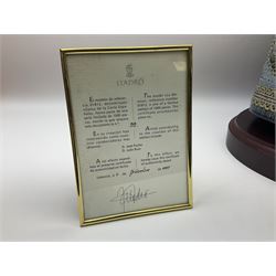 Large Lladro figure, La Menina, modelled as a maid of honor in service, on a mahogany oval base, limited edition 99/1000, sculpted by Jose Puche, with certificate of authenticity, framed and glazed, no 1812, year issued 1996, year retired 2019, H60cm