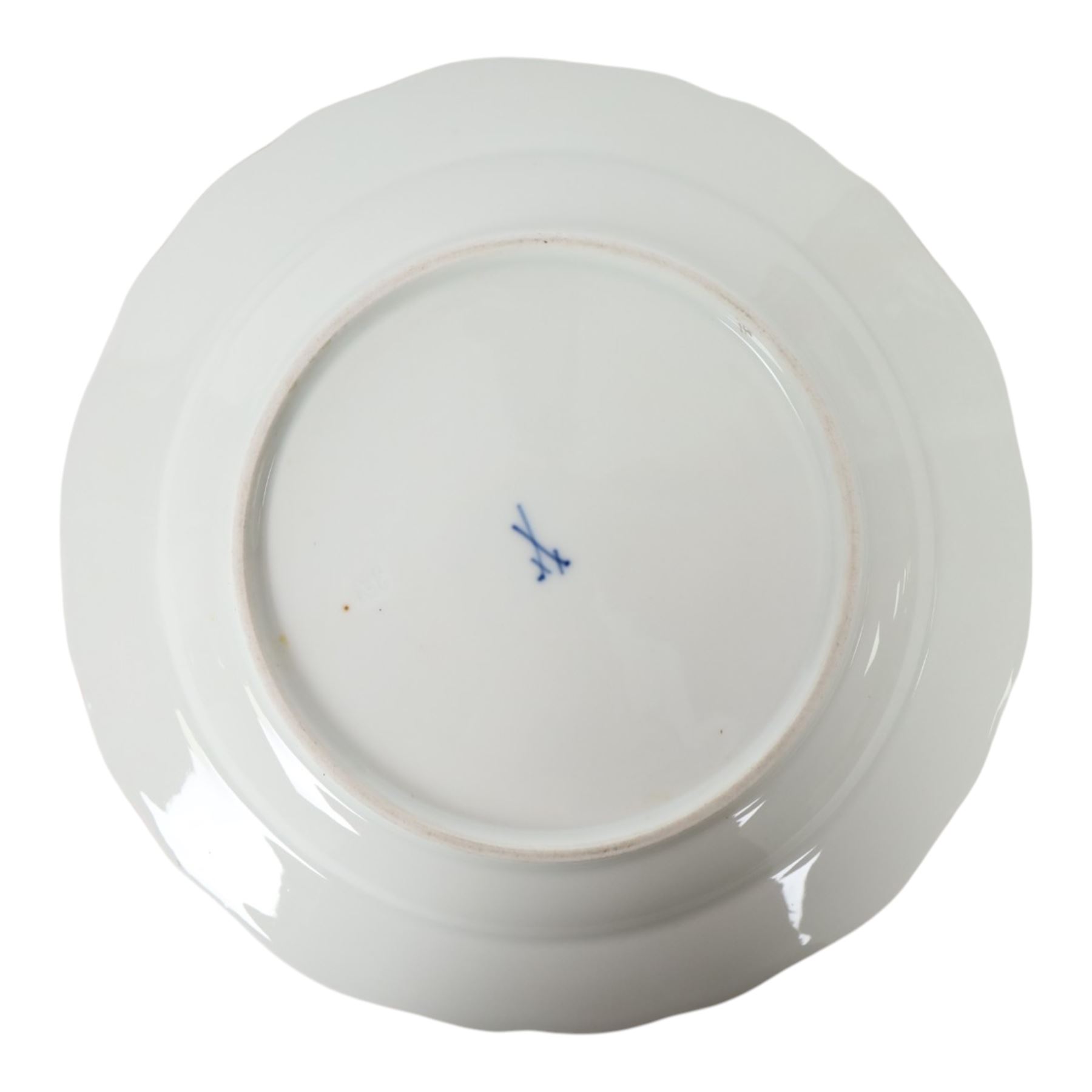 Four early 20th Century Meissen plates, hand painted with floral sprays, sprigs and inspects, with underglaze blue cross sword mark beneath, D21.5cm