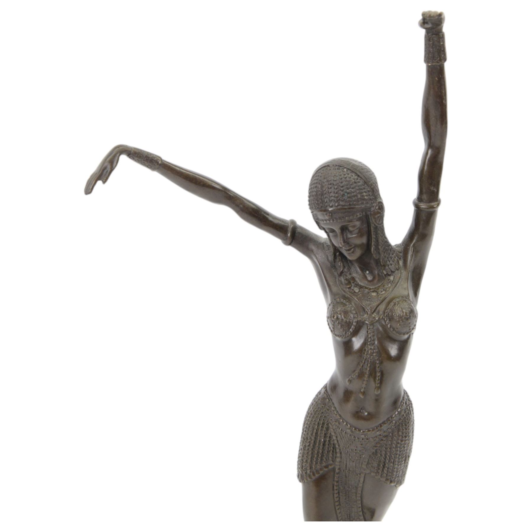Art Deco style bronze figure of a female dancer after Demetre Chiparus, with signature to base, upon a black marble plinth, H49cm