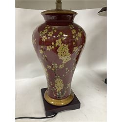 Pair of large table lamps of tapering form, decorated with Japanese blossom on a red ground, upon a square base, including shade H72cm