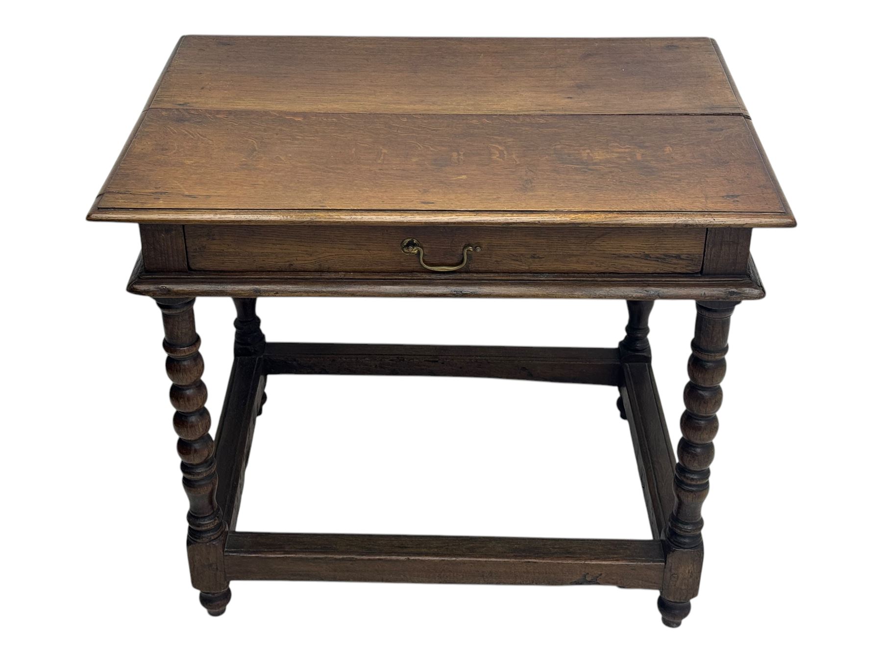 Late Victorian oak side table, rectangular top with moulded edge and frieze drawer with brass handle, raised on turned bulbous supports united by square-section stretchers