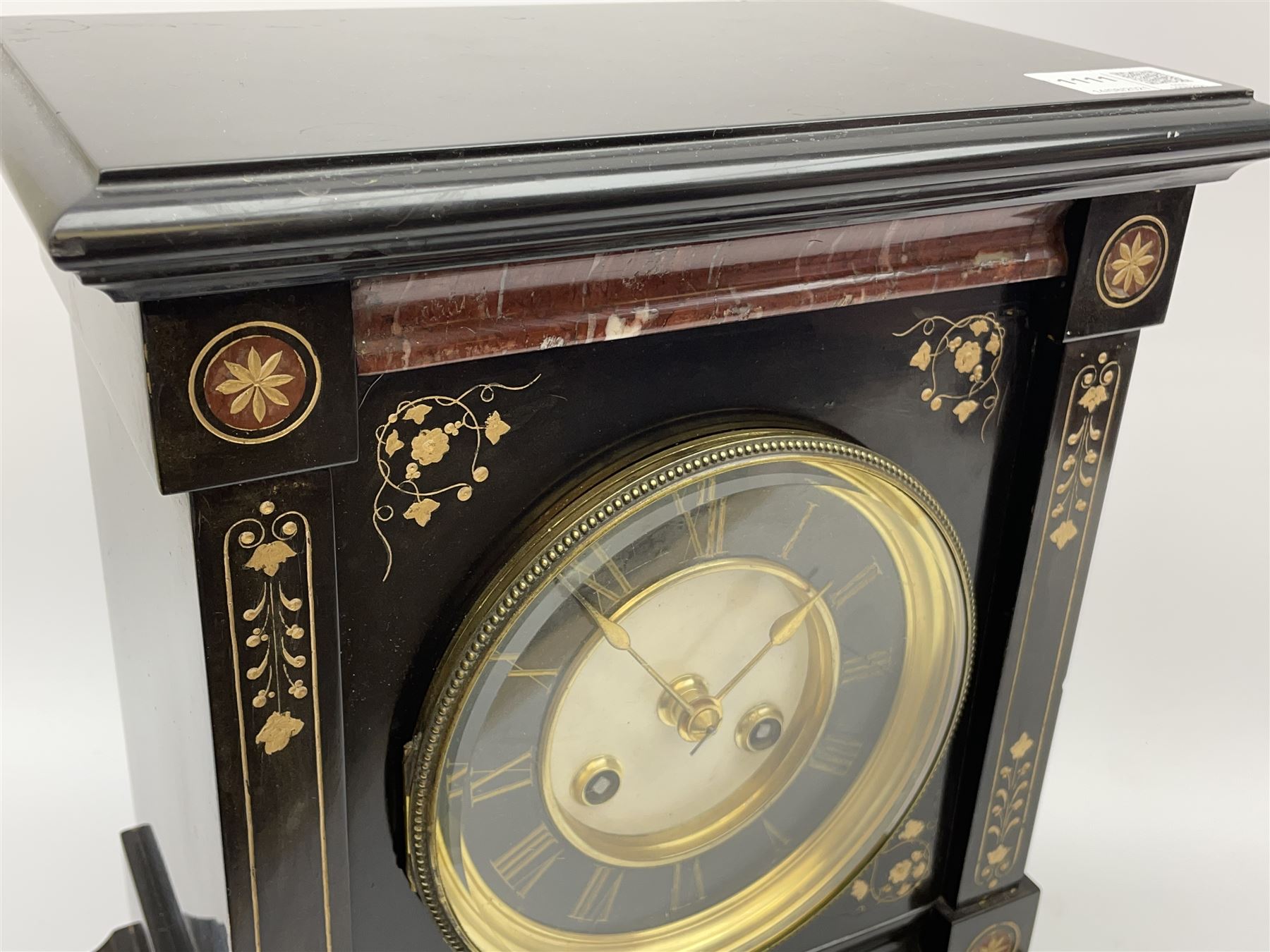Victorian black slate cased mantel clock, with rouge marble, engraved and gilt decoration, circular dial with Roman chapter ring, twin train eight day movement with brocot escapement, striking the hours and halves on bell, the movement back plate stamped 'B.R 39549 498'