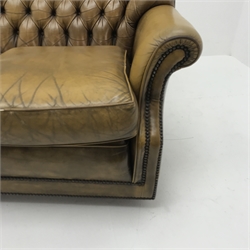 Pegasus three seat sofa upholstered in deeply buttoned antique brown leather, W185cm