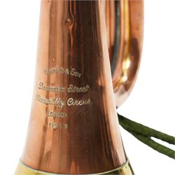 Copper and brass bugle, by Hawkes & Son London, marked to lower body and dated 1917, with green bugle cord