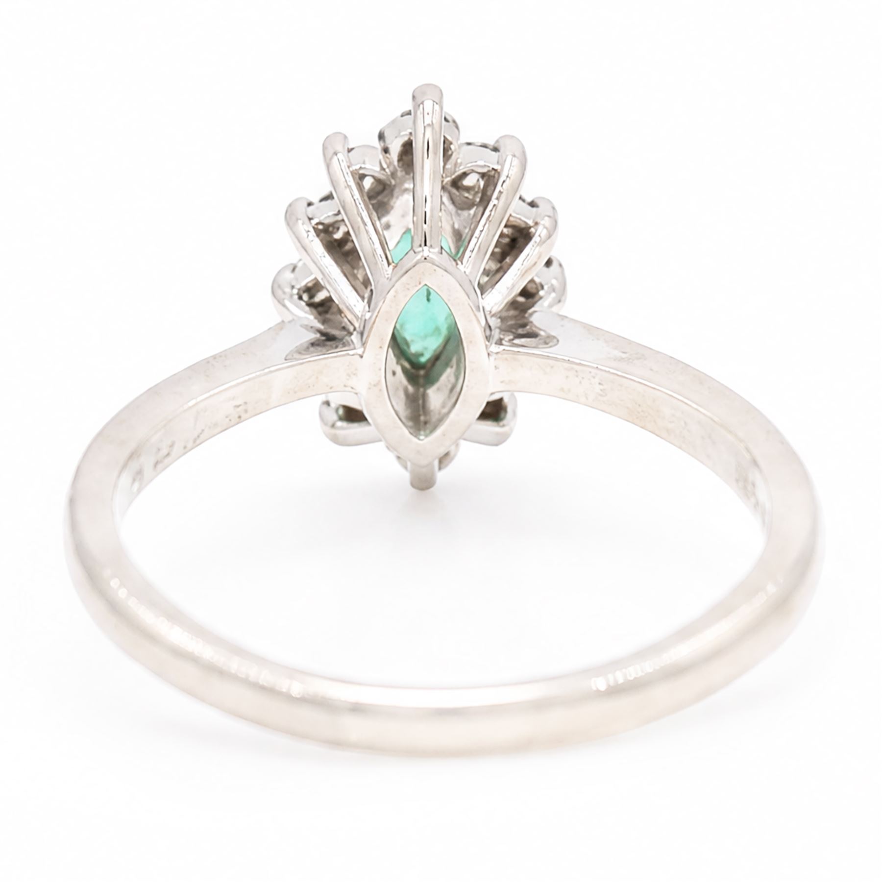 18ct white gold emerald and diamond cluster ring, single marquise cut emerald 0.25 carat, surrounded by twelve round brilliant cut diamonds, London 1979, total diamond weight approx 0.25 carat