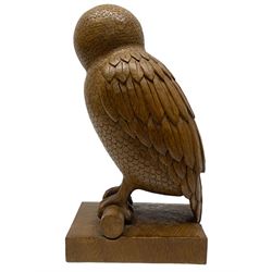 Acornman - carved oak owl perched on branch, on tooled block plinth carved with acorn signature, by the workshop of Alan Grainger, Brandsby (carved by Norman Darnley)