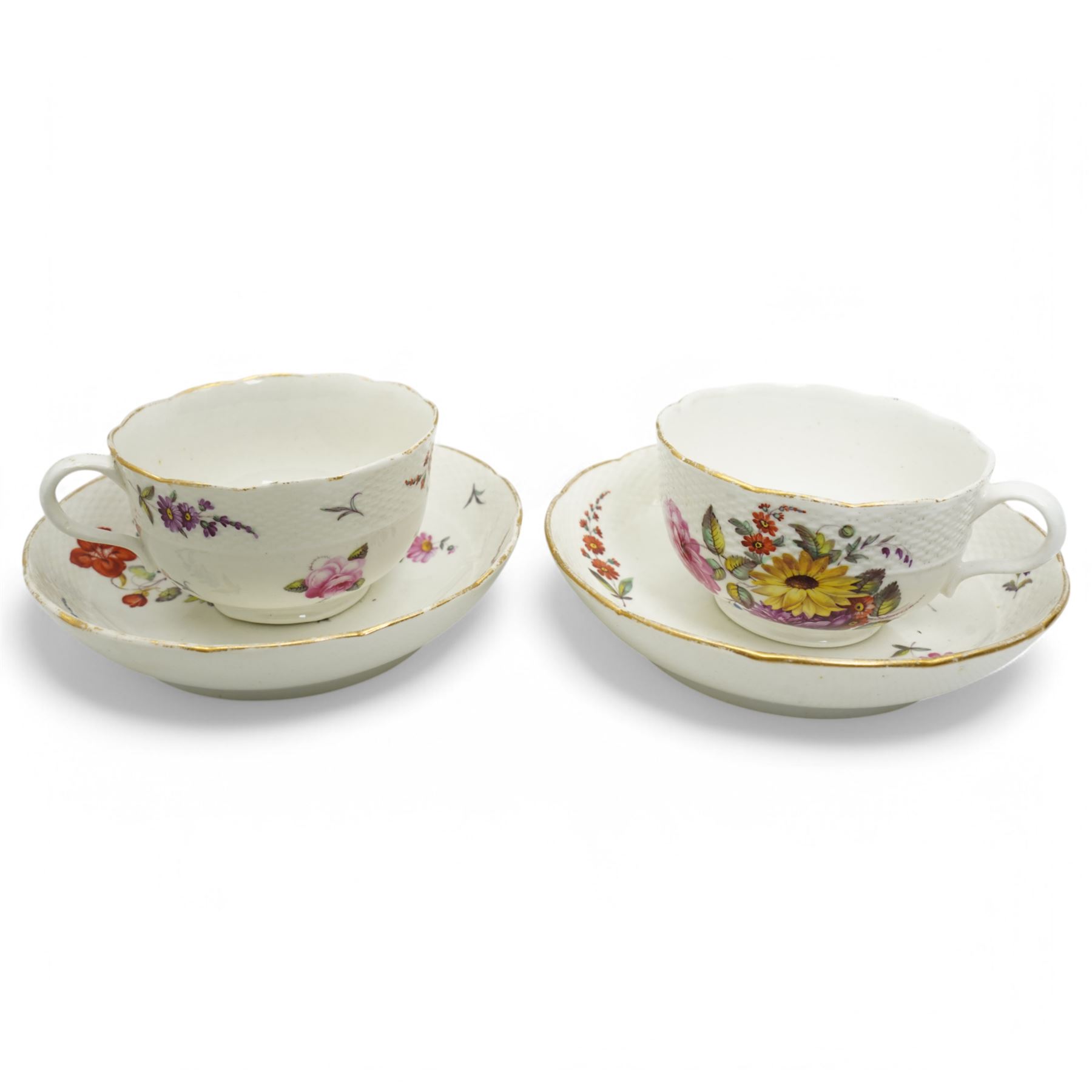 Pair of Derby teacups and saucers, attributed to William Billingsley, decorated with sprays of flowers with scalloped gilt edges, with crown, D mark and crossed batons in red, pattern no. 42 (4)